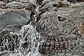 Kbal Spean, called also River of the Thousand Lingam, the riverbed and banks have been graven with linga and various sacred images of hindu divinities 